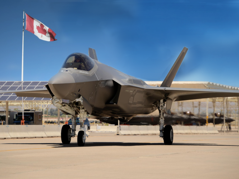 F-35 jet with Canadian flag in the background.