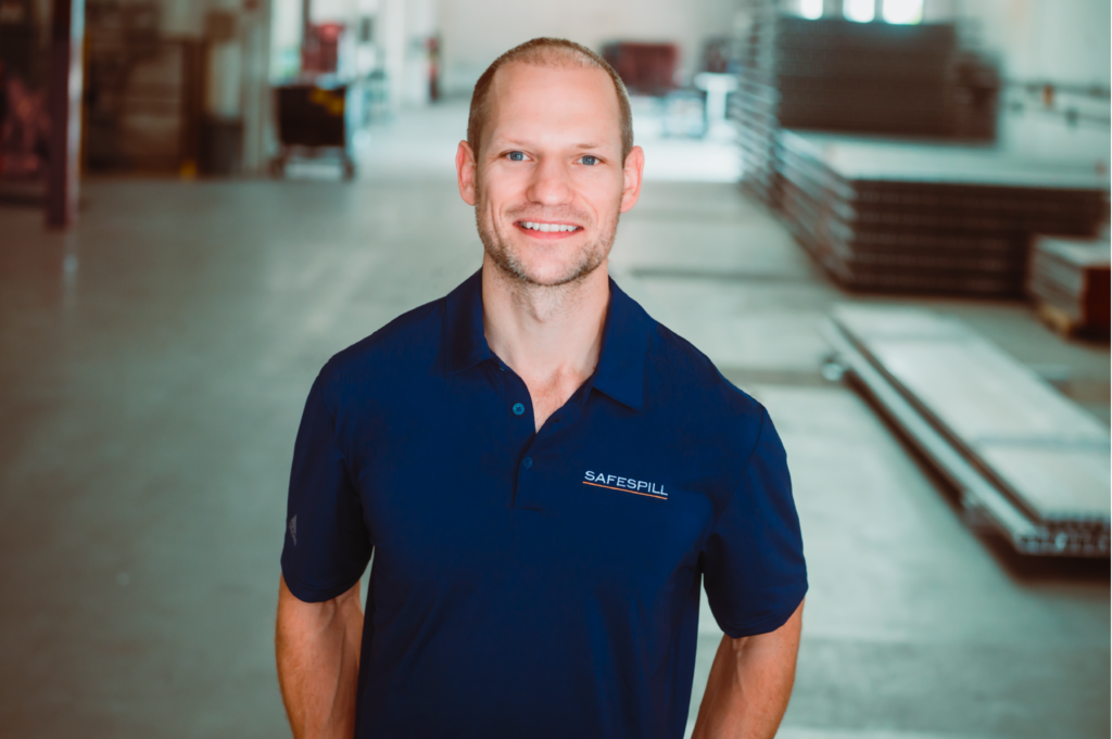 Tristan standing in warehouse.