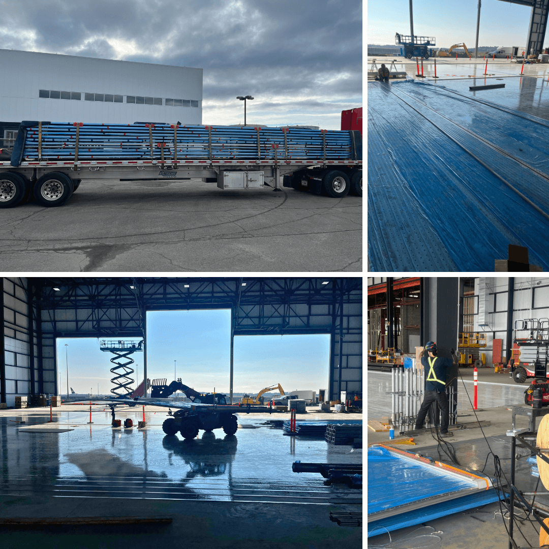 Flatbed truck with metal beams and workers installing flooring in a large indoor facility.