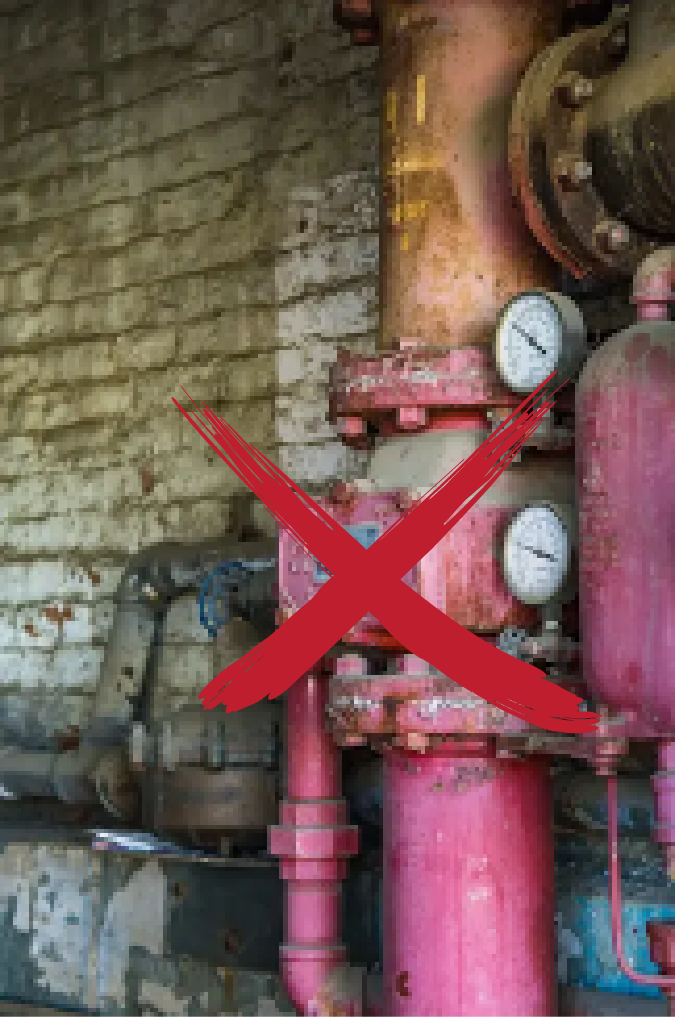 Old, rusty pipes with a large red X drawn over them, indicating disapproval or danger.