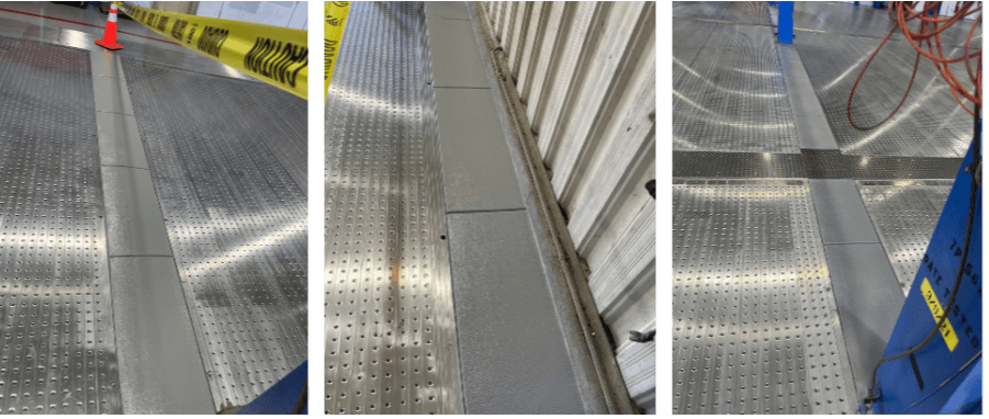 Metallic flooring with perforated panels and safety markings in an industrial setting.