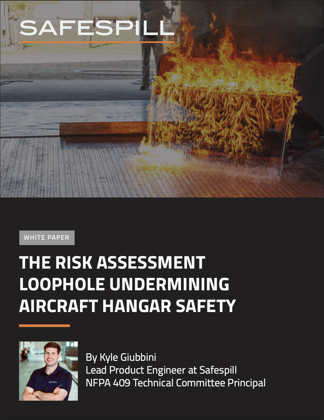 Fire simulation test underway on metal floor, highlighting safety in aircraft hangars.