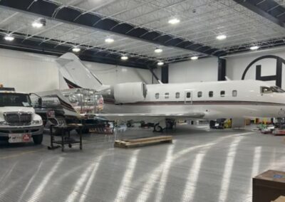 Leer jet and heavy trucks on ILDFA floor.